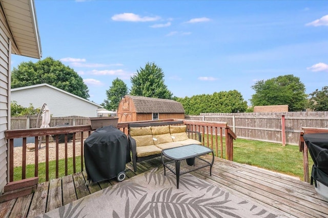 505 Tamula Dr, Mahomet, IL 61853 - wooden deck featuring grilling area, a fenced backyard, and a storage unit