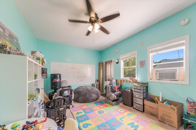 505 Tamula Dr, Mahomet, IL 61853 - rec room featuring cooling unit, a ceiling fan, and carpet floors