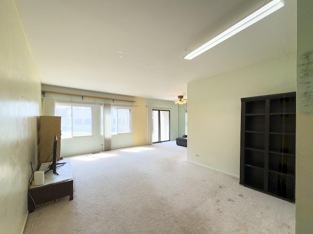 962 Harvest Cir, Buffalo Grove, IL 60089 - unfurnished living room with carpet floors and a ceiling fan