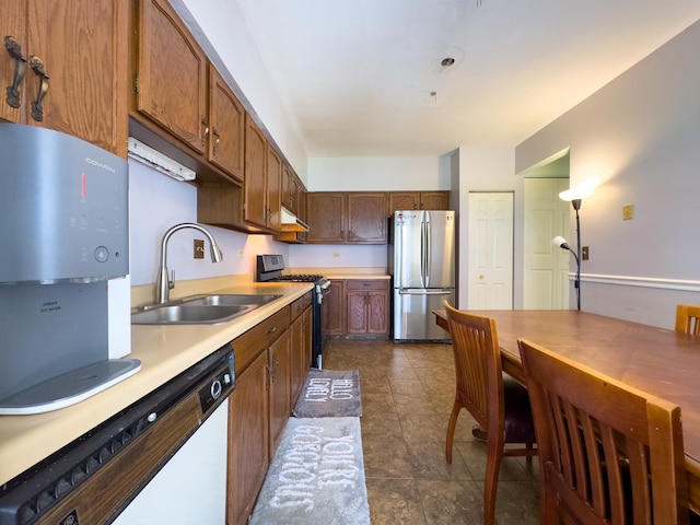962 Harvest Cir, Buffalo Grove, IL 60089 - kitchen with freestanding refrigerator, gas range oven, white dishwasher, light countertops, and under cabinet range hood