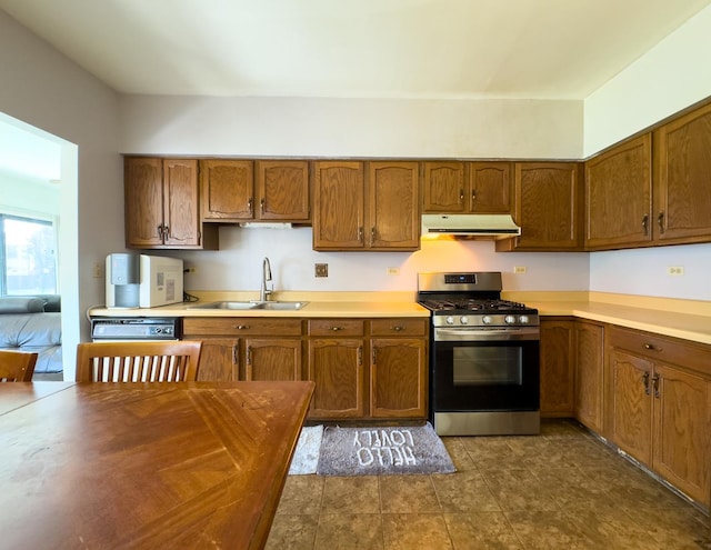962 Harvest Cir, Buffalo Grove, IL 60089 - kitchen featuring stainless steel range with gas cooktop, under cabinet range hood, brown cabinets, and light countertops