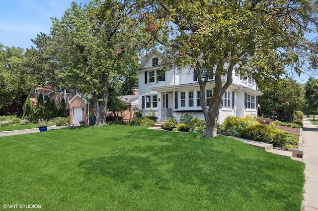 311 Wagner Rd, Northfield, IL 60093 - view of front of house featuring a front lawn and a garage