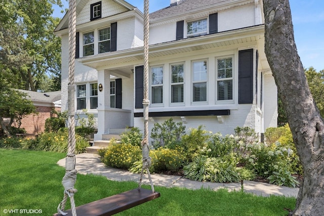 311 Wagner Rd, Northfield, IL 60093 - american foursquare style home featuring brick siding, a front yard, and a porch