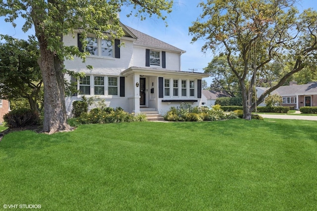 311 Wagner Rd, Northfield, IL 60093 - view of front facade featuring a front lawn and brick siding