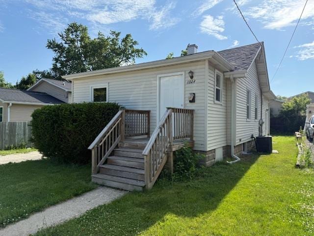 1023 N Elmwood Ave, Waukegan, IL 60085 - view of front of property featuring a chimney