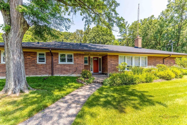 16 Yorkshire Dr, Lincolnshire, IL 60069 - ranch-style house with brick siding, a front lawn, and a chimney