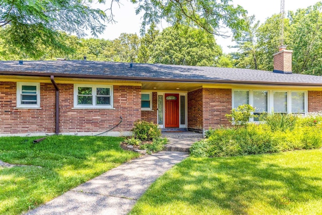 16 Yorkshire Dr, Lincolnshire, IL 60069 - ranch-style home with a chimney, brick siding, and a front lawn