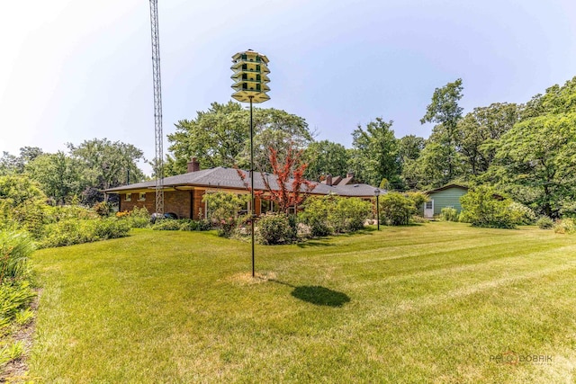 16 Yorkshire Dr, Lincolnshire, IL 60069 - view of green lawn featuring a garage