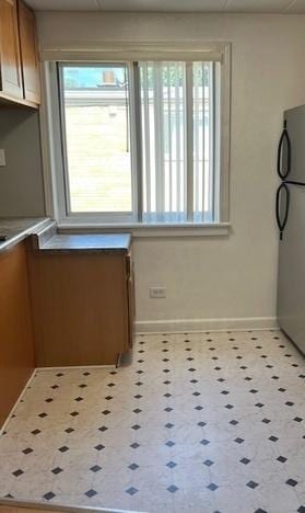 5209 S Leclaire Ave Unit 3B, Chicago, IL 60638 - unfurnished dining area featuring plenty of natural light and tile patterned floors