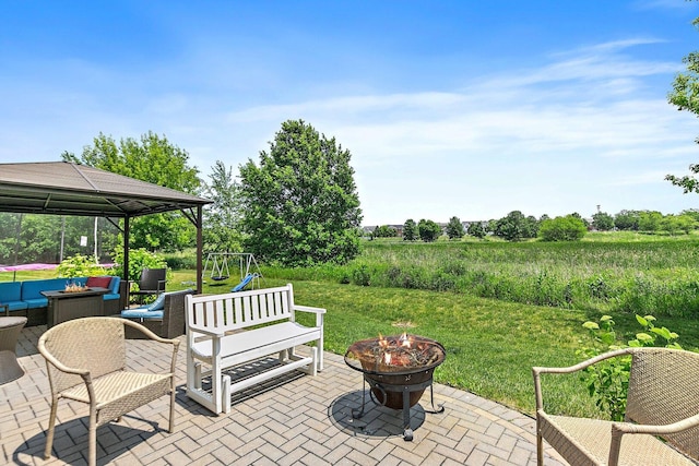 3512 Chancery Ln, Carpentersville, IL 60110 - view of patio featuring a gazebo and an outdoor living space with a fire pit