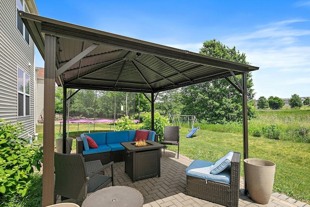 3512 Chancery Ln, Carpentersville, IL 60110 - view of patio featuring a trampoline, a gazebo, and an outdoor living space with a fire pit