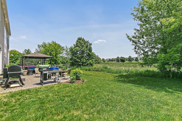 3512 Chancery Ln, Carpentersville, IL 60110 - view of grassy yard featuring a gazebo and a patio area