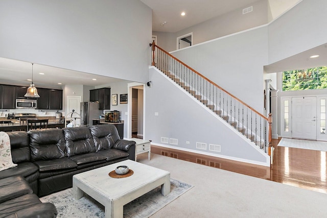 3512 Chancery Ln, Carpentersville, IL 60110 - living area featuring a high ceiling, stairs, and recessed lighting