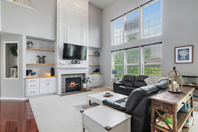 3512 Chancery Ln, Carpentersville, IL 60110 - living area with a high ceiling, a tiled fireplace, and wood finished floors