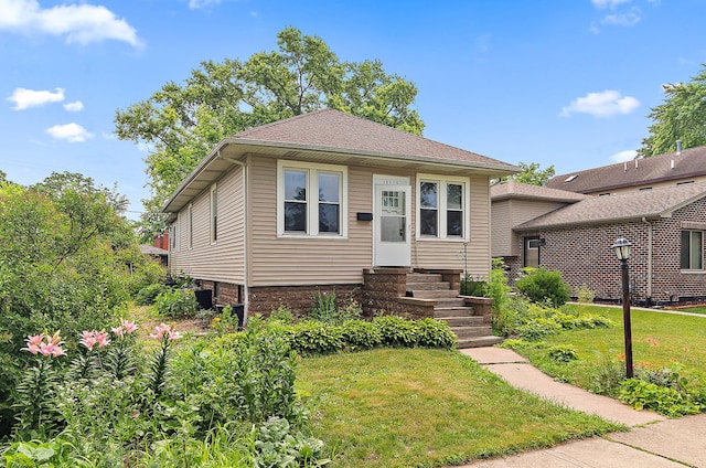 18329 Klimm Ave, Homewood, IL 60430 - view of front facade featuring a front yard and entry steps