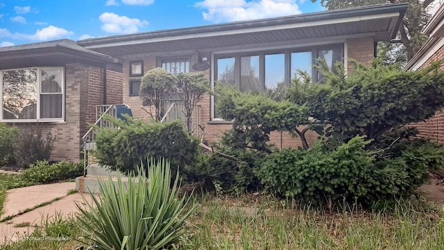 10240 S Torrence Ave, Chicago, IL 60617 - view of property exterior featuring brick siding