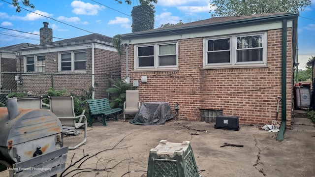 10240 S Torrence Ave, Chicago, IL 60617 - back of house with brick siding, a patio area, and a chimney