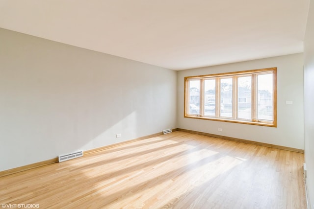 3671 Sarah St, Franklin Park, IL 60131 - unfurnished room featuring wood finished floors and baseboards