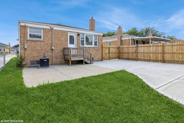 3671 Sarah St, Franklin Park, IL 60131 - rear view of property with brick siding, a patio area, and a chimney