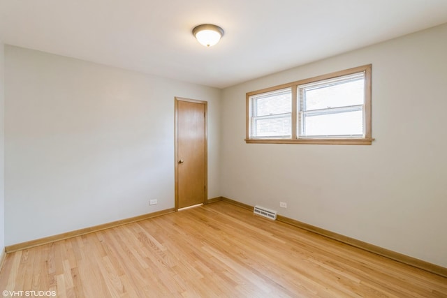3671 Sarah St, Franklin Park, IL 60131 - spare room featuring light wood-type flooring and baseboards