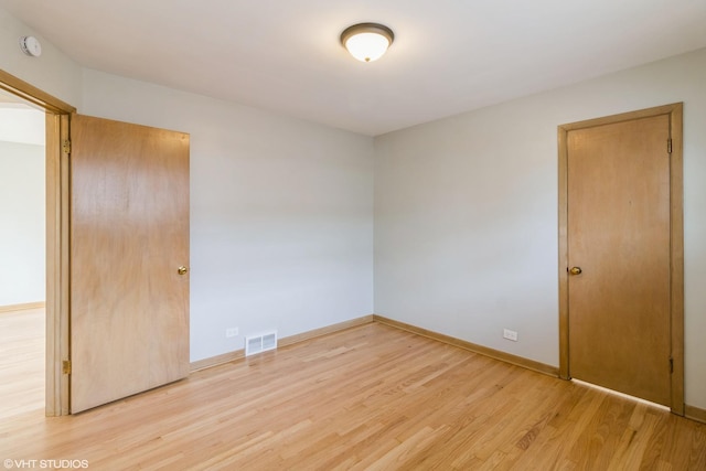 3671 Sarah St, Franklin Park, IL 60131 - unfurnished bedroom with light wood finished floors and baseboards