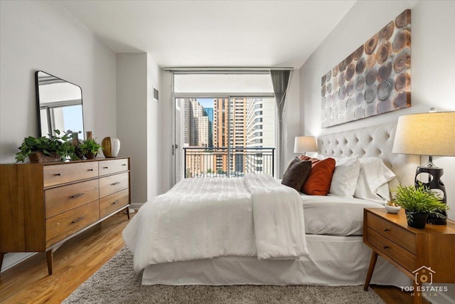 1250 S Michigan Ave Unit 1007, Chicago, IL 60605 - bedroom featuring wood finished floors and access to outside