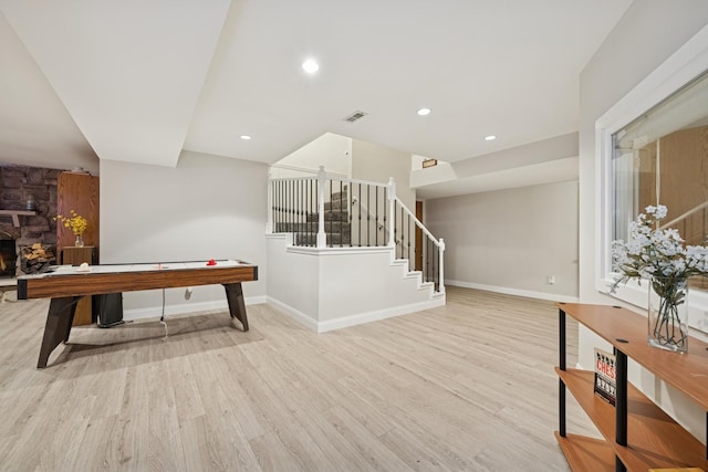 19466 W Aspen Dr, Mundelein, IL 60060 - playroom with wood finished floors, a stone fireplace, and recessed lighting