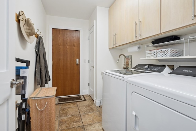 19466 W Aspen Dr, Mundelein, IL 60060 - washroom featuring cabinet space, separate washer and dryer, and light stone finish floors