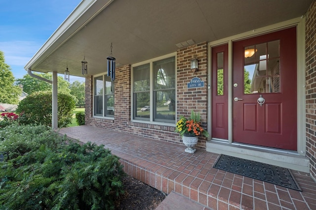 19466 W Aspen Dr, Mundelein, IL 60060 - doorway to property with a porch and brick siding