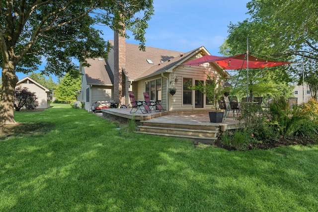 19466 W Aspen Dr, Mundelein, IL 60060 - back of property with a chimney, a yard, and a deck