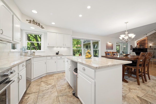 19466 W Aspen Dr, Mundelein, IL 60060 - kitchen featuring plenty of natural light, a chandelier, range, tasteful backsplash, and recessed lighting