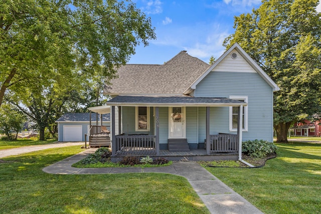 206 W N St, Leroy, IL 61752 - view of front of house with a shingled roof, a porch, a front lawn, and an outbuilding