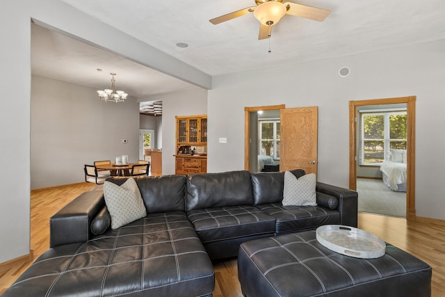 206 W N St, Leroy, IL 61752 - living area with a chandelier, a ceiling fan, and wood finished floors