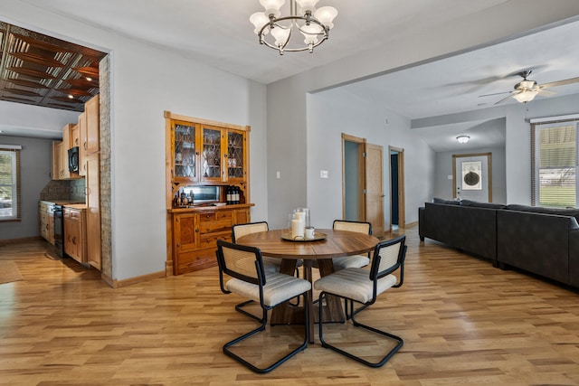 206 W N St, Leroy, IL 61752 - dining space featuring plenty of natural light, light wood-style flooring, a chandelier, and ceiling fan