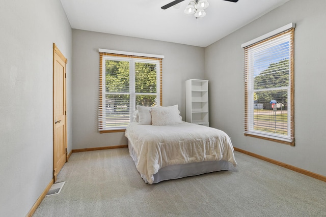 206 W N St, Leroy, IL 61752 - bedroom featuring light carpet, multiple windows, and ceiling fan