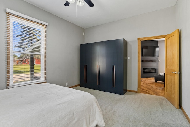 206 W N St, Leroy, IL 61752 - carpeted bedroom featuring baseboards and ceiling fan