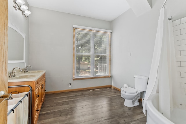 206 W N St, Leroy, IL 61752 - full bath featuring vanity, wood finished floors, and shower / bath combo