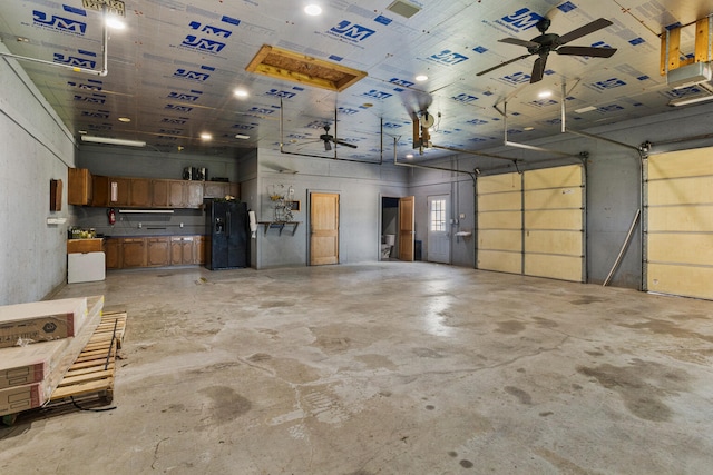 206 W N St, Leroy, IL 61752 - garage featuring black fridge and ceiling fan