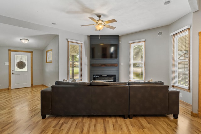 206 W N St, Leroy, IL 61752 - living area with a fireplace, light wood-type flooring, ceiling fan, and plenty of natural light