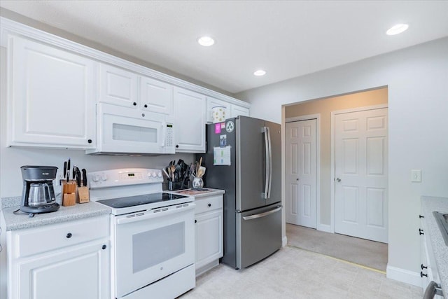 2236 Boulder Dr, Normal, IL 61761 - kitchen featuring white appliances, white cabinetry, light countertops, recessed lighting, and light colored carpet