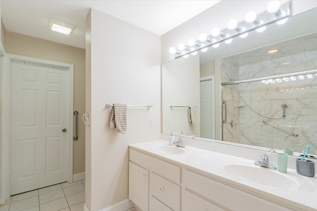 2236 Boulder Dr, Normal, IL 61761 - full bath featuring a marble finish shower, double vanity, and tile patterned floors