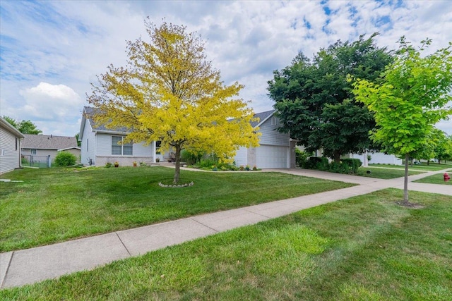 2236 Boulder Dr, Normal, IL 61761 - obstructed view of property with a garage, a front lawn, and driveway