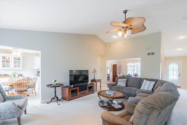 2236 Boulder Dr, Normal, IL 61761 - living area featuring a ceiling fan, light colored carpet, a chandelier, and high vaulted ceiling