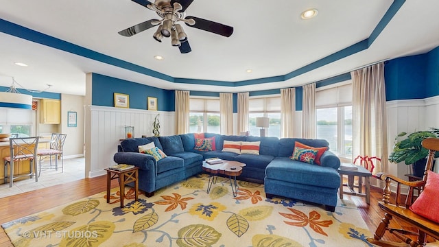 25333 W Richmond Ave, Antioch, IL 60002 - living room with a ceiling fan, a raised ceiling, light wood-style floors, a wainscoted wall, and recessed lighting