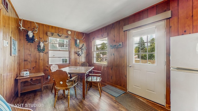 25333 W Richmond Ave, Antioch, IL 60002 - dining space featuring wood finished floors and wood walls