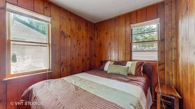 25333 W Richmond Ave, Antioch, IL 60002 - bedroom featuring multiple windows and wood walls