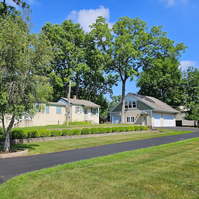 25333 W Richmond Ave, Antioch, IL 60002 - view of front of house featuring a front yard and a chimney