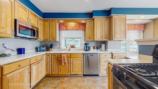 25333 W Richmond Ave, Antioch, IL 60002 - kitchen with appliances with stainless steel finishes, healthy amount of natural light, and light countertops