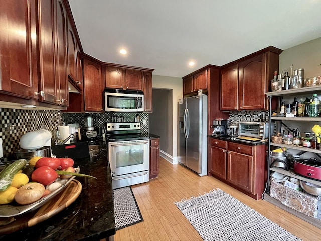 5511 Chateau Dr Unit 5, Rolling Meadows, IL 60008 - kitchen featuring stainless steel appliances, decorative backsplash, light wood-type flooring, recessed lighting, and dark stone counters