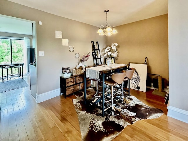 5511 Chateau Dr Unit 5, Rolling Meadows, IL 60008 - dining area featuring a chandelier and wood finished floors